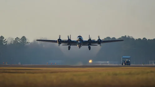 Vintage four‑engine airplane lifting gracefully from runway.