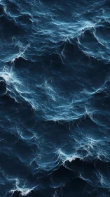 Detailed overhead view of deep blue ocean surface waves.