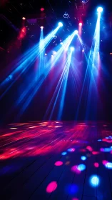 Stage lighting beams project onto empty reflective floor surface