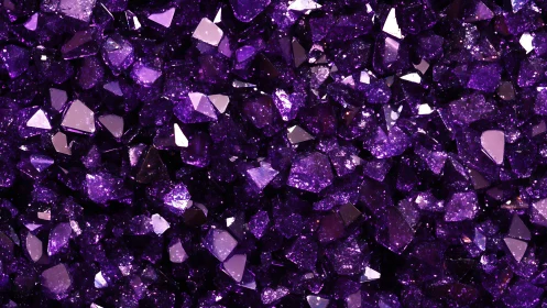 Macro capture of faceted violet crystal fragments under light