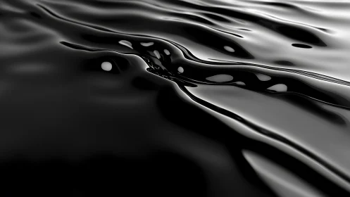 Close-up view of reflective black liquid surface textures.