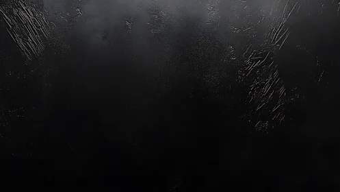 Textured black surface shows subtle scratches and gloss