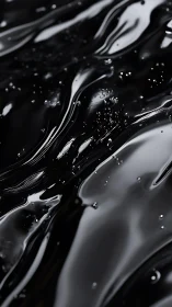 Liquid black surface with reflective viscous wave patterns.