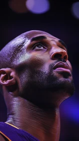 Upward gaze of determined basketball player under arena lights.