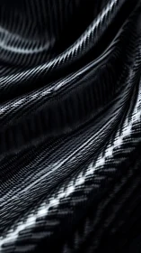 Close-up of folded black woven synthetic fiber surface.