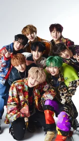 Eight-person group portrait shows colorful layered streetwear