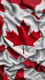 Textured Canadian maple leaf flag in dynamic closeup.