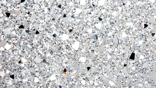 Silver holographic glitter texture with sparkling geometric shapes.