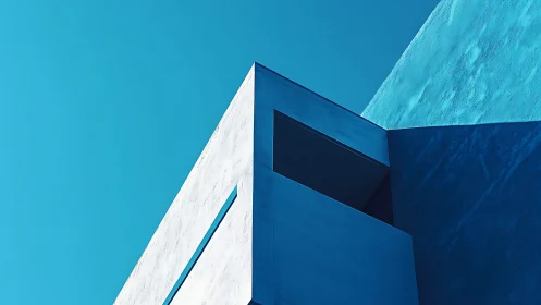 Minimalist blue architecture angles catch bright urban sky.