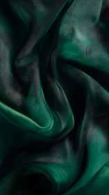 Microscopic teal textile folds with sculpted specular highlights.