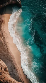 Waves break diagonally along steep sandy and rocky shoreline