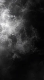 Luminous white smoke swirls dramatically in deep darkness