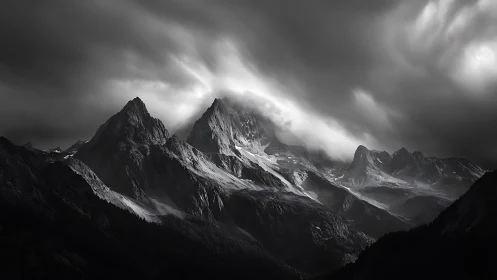Storm-lit alpine massif renders sculptural monochrome drama