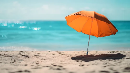 Orange beach umbrella casts shade on tranquil shoreline.