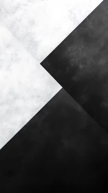 Monochrome diagonal planes with textured black and white surfaces.