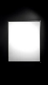 Backlit minimalist lightbox isolates in high-contrast darkness