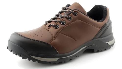 Brown low-cut hiking shoe with rugged black outsole shown