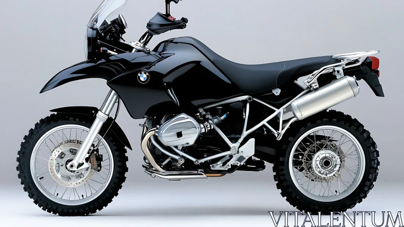 Black BMW adventure motorcycle on neutral studio background.