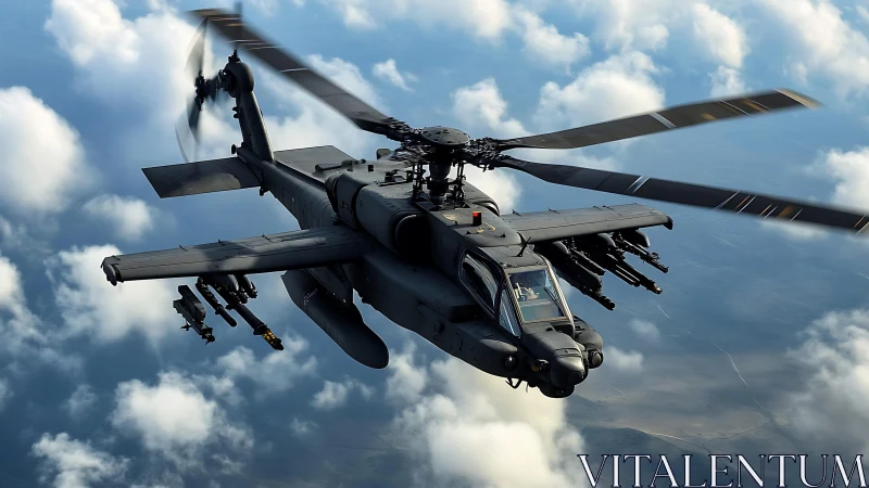 Military attack helicopter in midair flight above clouds.