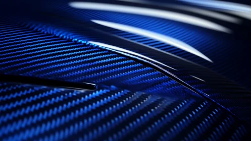 Blue carbon fiber surface with reflective curved highlights.