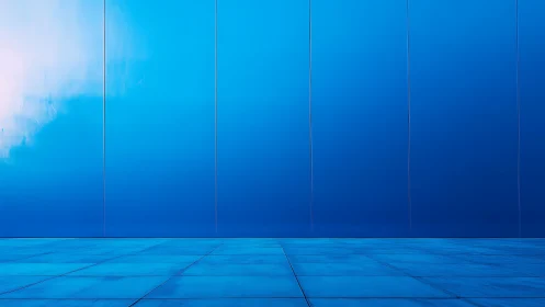 Minimalist blue facade and tiled floor form planar geometric field