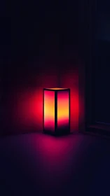 Neon gradient lamp glows softly in a dark minimalist corner