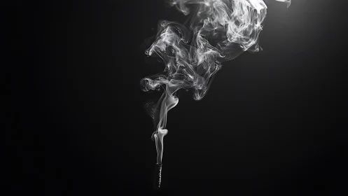 Fine incense smoke curls upward against deep black ground