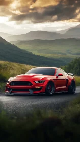 Red performance coupe contrasts against misty highland valley