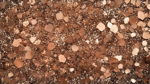 Copper glitter particles form dense reflective surface