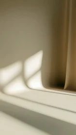 Soft beige drapery with geometric window light shadows.