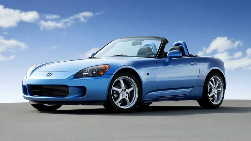 Skyline-blue roadster parked under clear daylight sky.