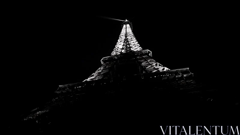 Illuminated lattice tower captured from low angle at night