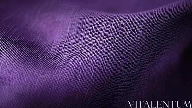 Soft waves of purple fabric glow in gentle close-up light
