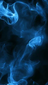 Ethereal blue smoke curls drift upward in dark stillness
