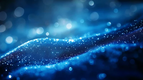 Blue bokeh wave glows with shimmering particle light field.