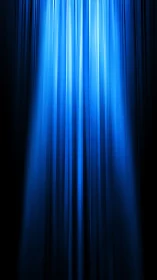 Gently glowing blue stage curtains invite the show to begin.