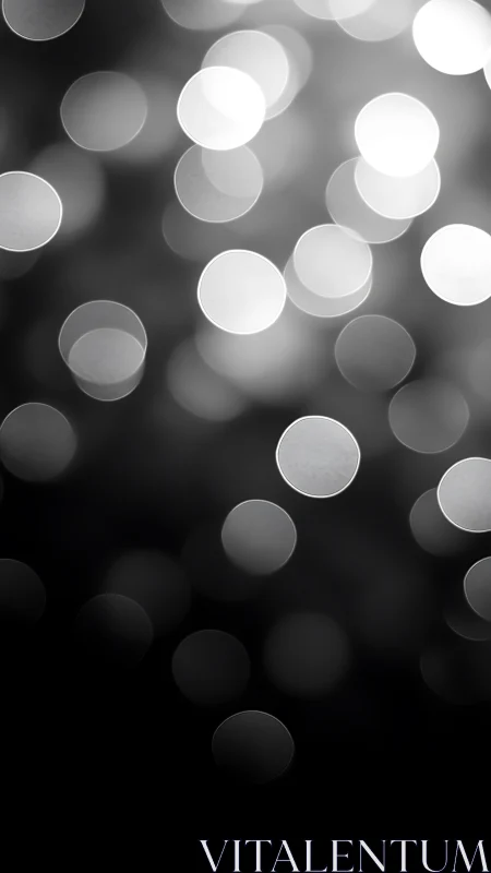 Luminous grayscale bokeh orbits drifting through soft night.