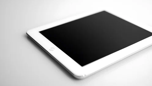 White iPad with dark display on neutral background.