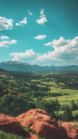 Photorealistic red rock valley with distant alpine ridge panorama.