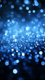 Blue bokeh lights form shimmering abstract depth field.