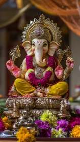 Ganesh idol radiates gold detail and vivid festive color.