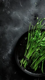 Fresh herb stalks rest on black ceramic plate surface