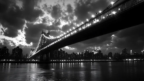 Monochrome suspension bridge over nocturnal skyline study.