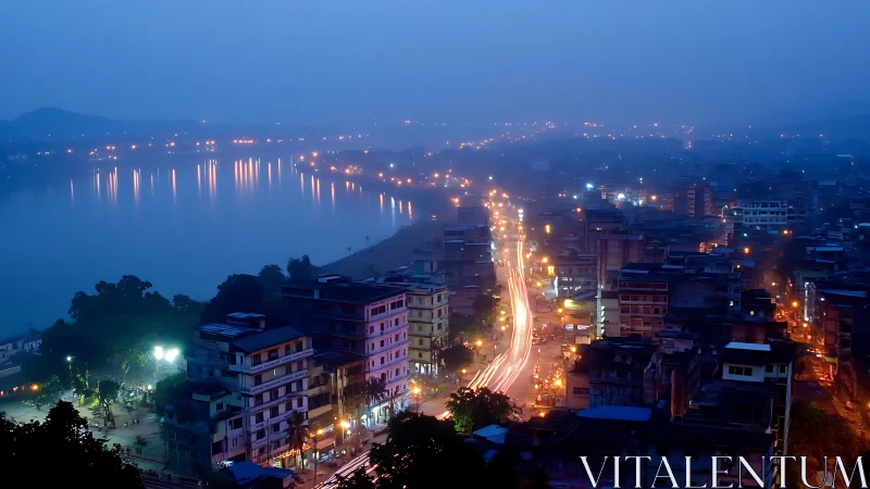 City avenue and lakeside lights captured at blue hour.