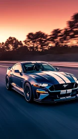 Sleek striped sports car racing under vivid sunset sky.