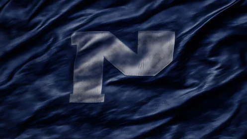 Photorealistic fabric banner with embossed metallic N monogram.