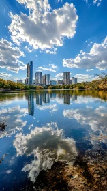 High-rise skyline mirrored in lake with dramatic cumulus cloudfield