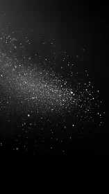 Photorealistic particulate scatter on dark negative space.