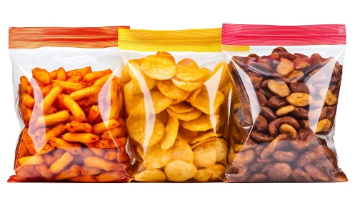Three colorful plastic snack bags filled with crunchy treats.