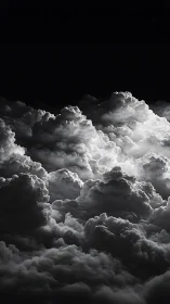 Monochrome cumulonimbus field rendered in dramatic chiaroscuro